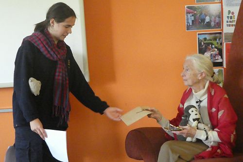 Emma presenting Jane with a handmade gift.