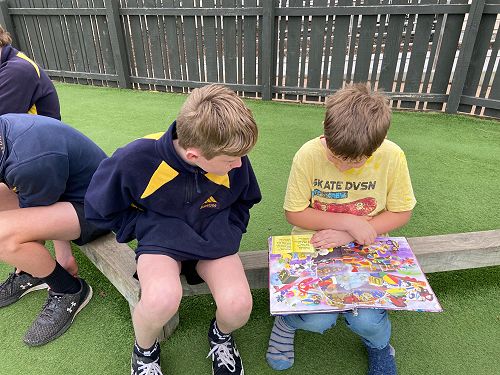 Tyson reading with his buddy Ashton