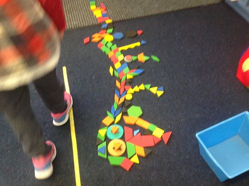Wow, what an amazing Taniwha made from shapes!!  The yellow line assists with our gross motor skill of walking heal to toe on the line.