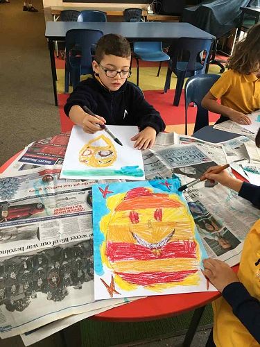 Room 10 made posters representing 'happy'