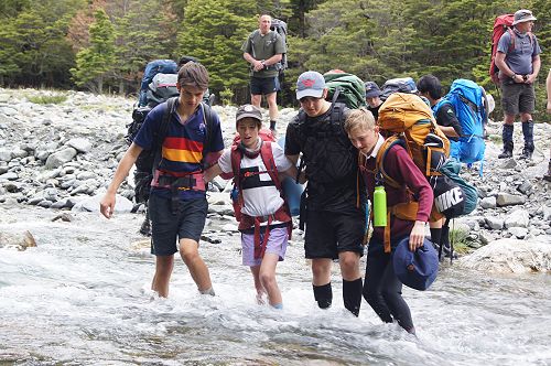 Bailey, Ben, Caine and Cam cross the Temple North Branch at the start of the tramp