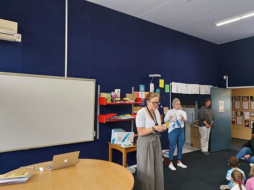 Janelle talks to the school using Roger Technology and Poppy interprets.