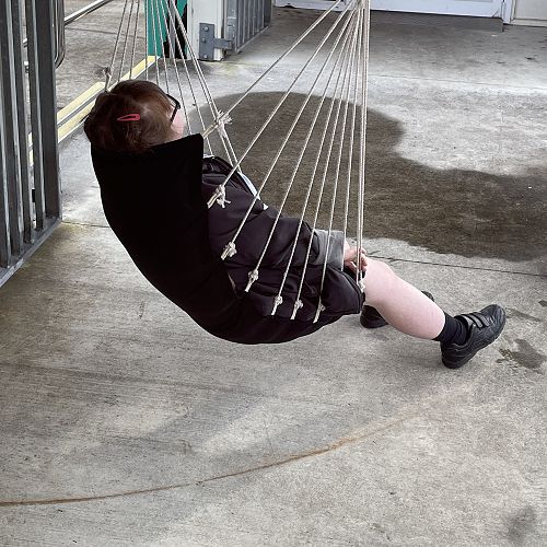 Kirsty has started the day just like we would all like to.  A wee snooze in a swinging chair.  Nice!