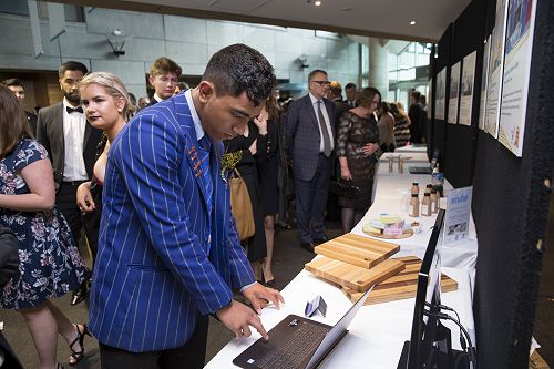 Jade Uliano setting up display at Te Papa