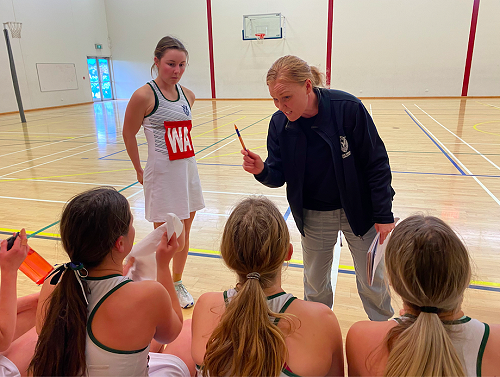 Mrs Piebenga providing the team with feedback during a quarter break