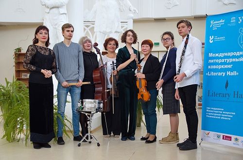 The septet, conducted by composer Sofia Filyanima (5th from left), that presented a musical setting of David Howard's 'Roll of Honour' at the opening of Literary Hall. 