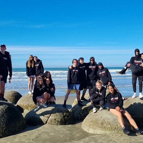 Both teams at Moeraki Boulders on the trip down to Dunedin.