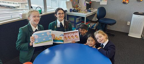 Year 9 class sharing their stories with Year 1-2 Students