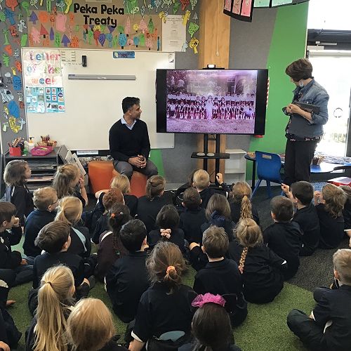 Rafi Raja sharing with the tamariki what it was like to go to school in Malaysia.