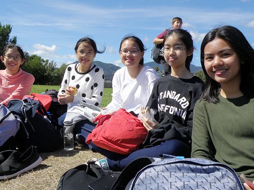 Some of our visiting Thai students enjoy the action on the field.