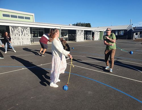 Our senior staff learning a new game!