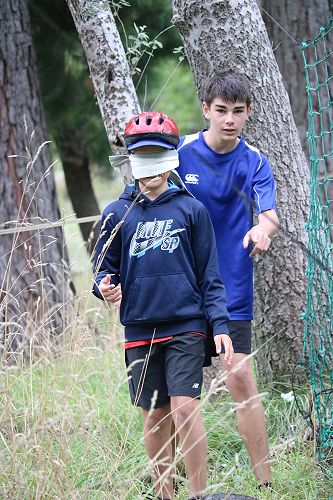 Flynn carefully guiding Riley through the blind trail