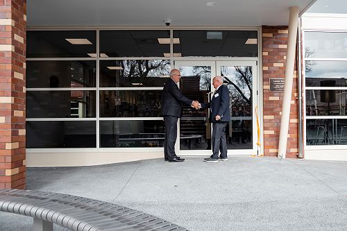 Grant and John shake hands