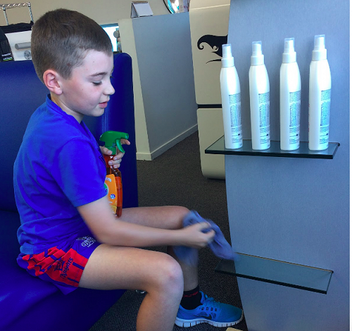 Oli helping at a local hair salon. 