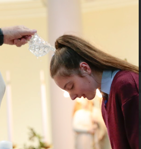 Lilliana Davis receiving the Sacrament of Baptism