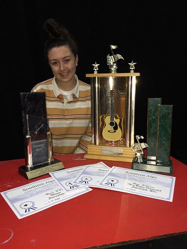 Neve O'Connor with her certificates and trophies