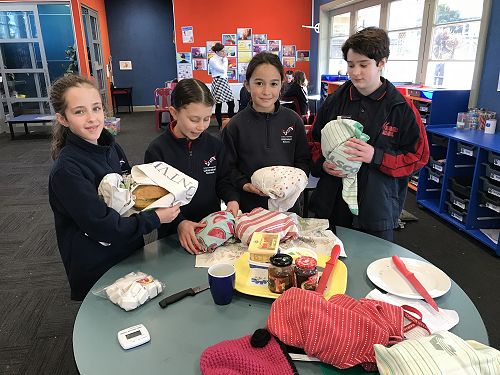 Georgia, Emilie, Tiani and Emily with 6 baked loaves.