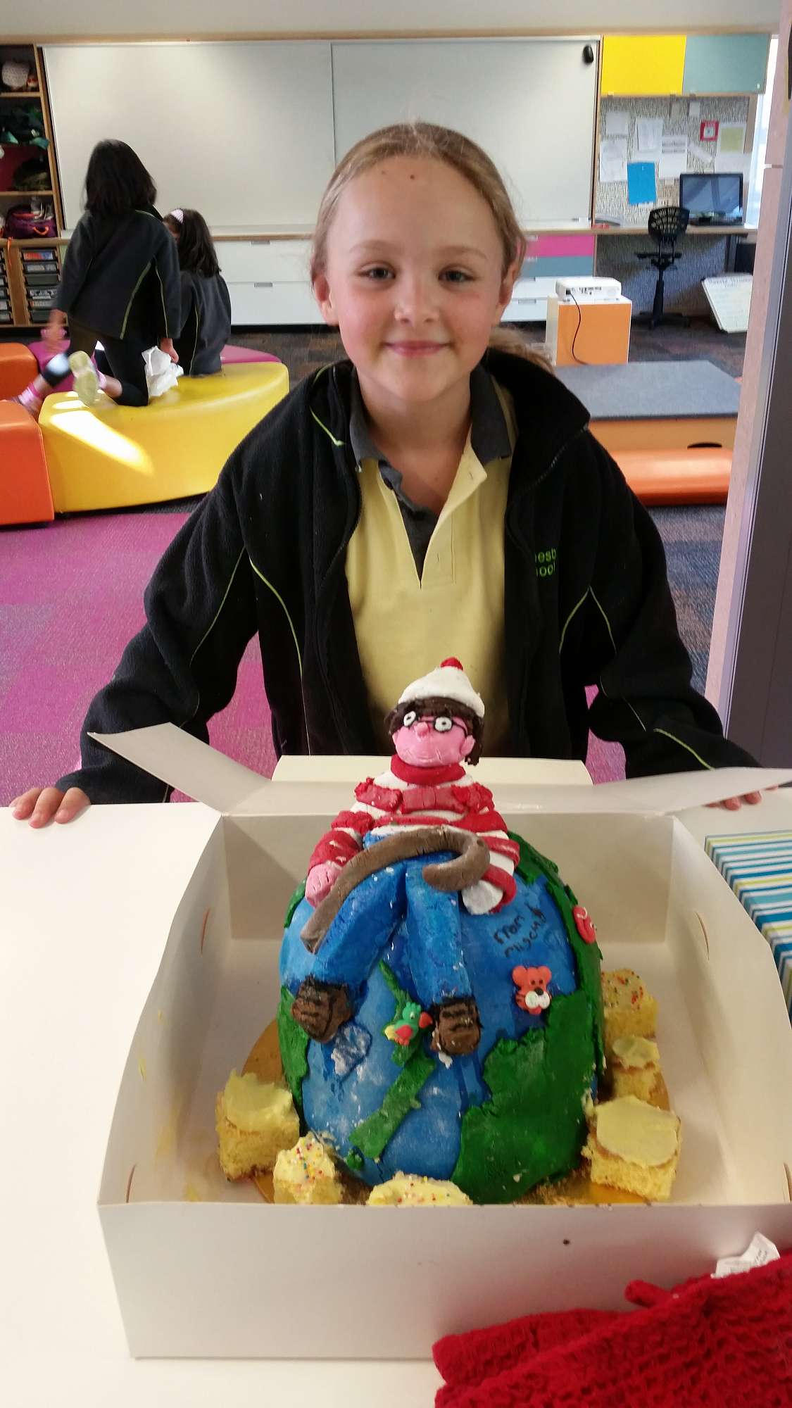 Mischa, with the amazing 'Where's Wally?' cake she made with Kirsty for our Living Globally inquiry. 