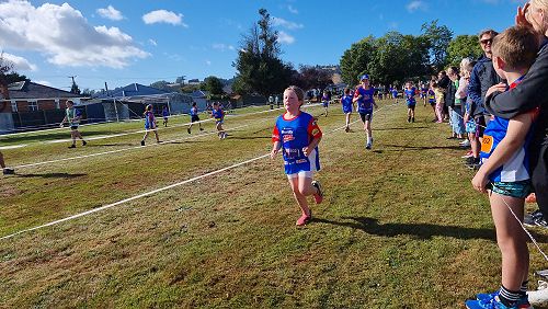 Year 4 Poppy completing her run leg