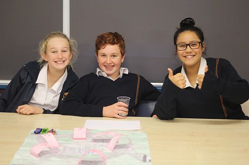 Samantha Laing, Jack Anderson, Avalon Te Haara-Barr demonstrate their game.