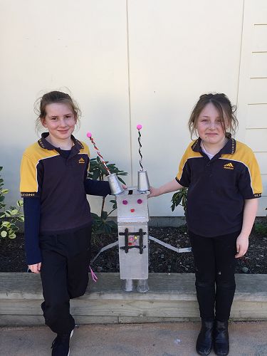 Amelia and Addy with their robot, Tommy