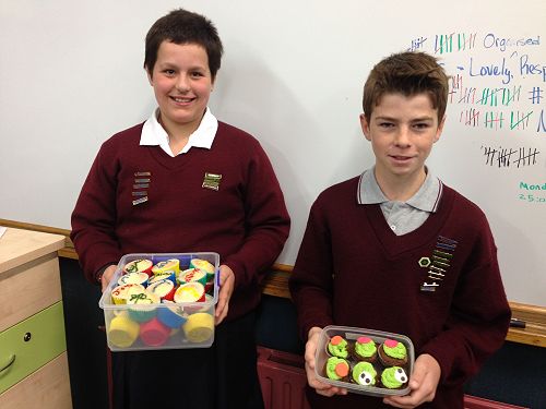 Caitlin and Caleb created decorated cupcakes