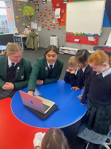 Year 9 class sharing their stories with Year 1-2 Students