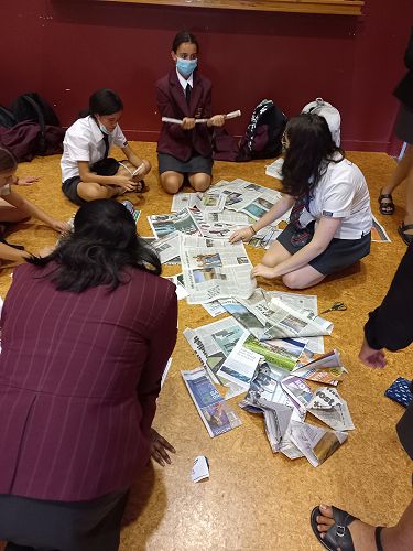 Campbell students constructing fashion from newspaper! 