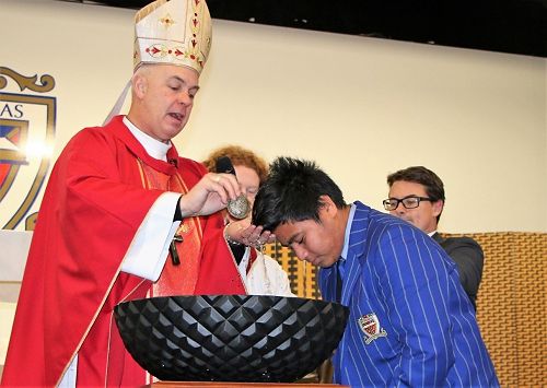 JOSM Here is Jeremiah Neli being baptized