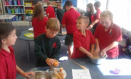 Jesse grating apple for our apple crumble