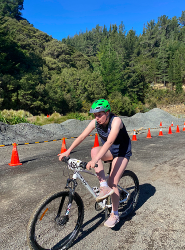 Poppy Edmond competing the Mountain biking Challenge