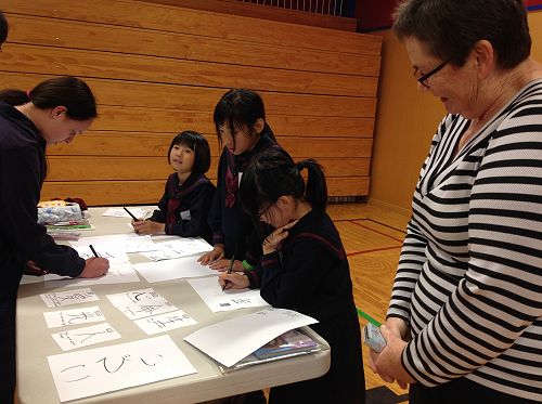 These girls showed us how to write our name in Jap