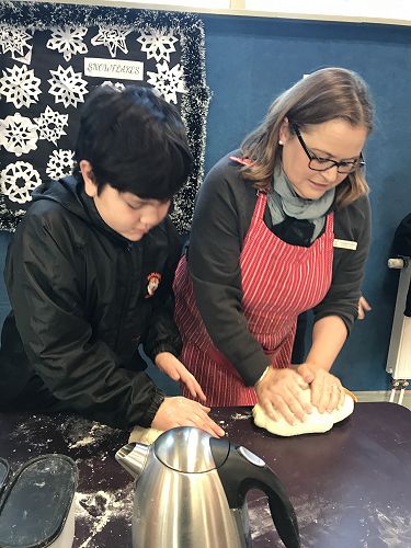 Levi and Whaea Catherine getting into the kneading of the dough.