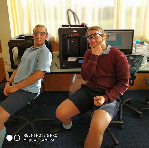 Jack and Josh contemplate what to design next as their fidget spinners are being printed