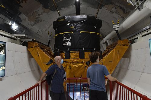 Mike and Alex inside the Space Shuttle with the satellite motor at the back. This was used to relaunce the  Intelsat 11 satellite into the correct orbit.