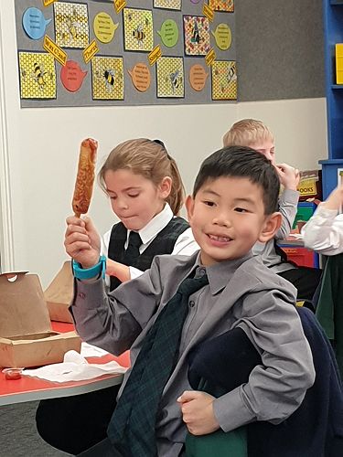 Birthday boy Lucas with his hotdog