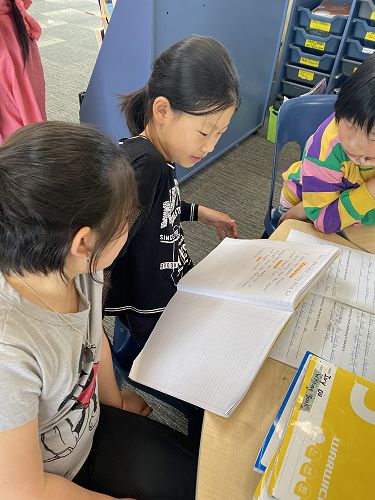 Ivy practicing showing her evidence for Student Led Conferences