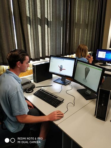 Toby designing his model rocket in CAD computer software so he can 3D print a prototype