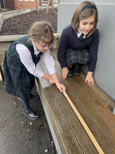 Look! I can measure like a pro with my feet, hands and ruler!