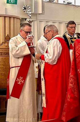 Pihopa Rihare Wallace gives Andrew Communion