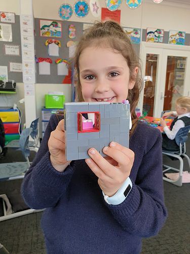 Maya with her unicorn house