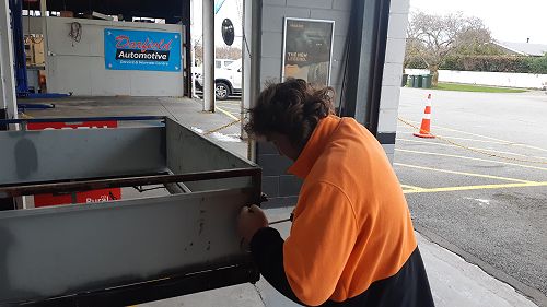 Jack working on an upgrade to a trailer. The trailer is being re-wired and will be having the existing lights replaced with LED lights.