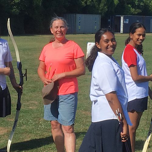 Archery girls with coach Maria Tucker on the field from the first Tuesday session.