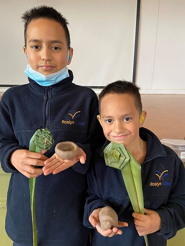 Blaze Malcolm (left) and Braxton Malcolm with their clay art and flax putiputi at KIT Day in term 3