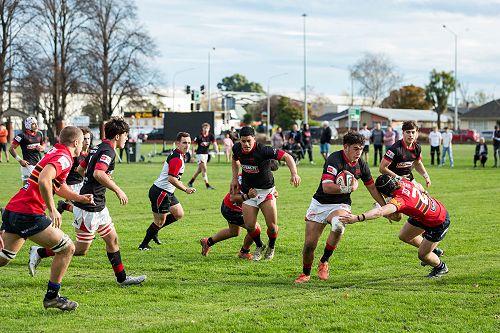Fend: Christian Ioane storms through the St Thomas's defence.