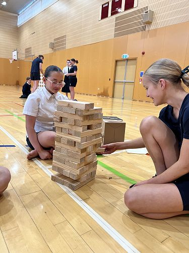 Valentina and Jeila trying their hand at Jenga