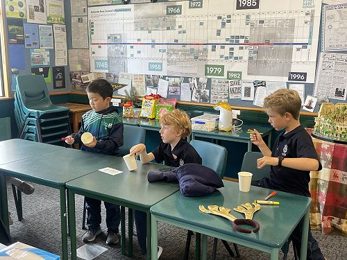 Years 0-3 making their creations.