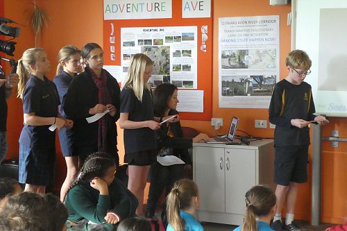 Our group presenting our slide show about 'People, Place, and Animals'.