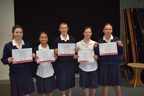 Students from 9CLJ receiving certificates for participating in an online research project with a Thai High School.