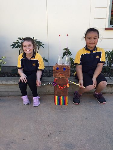 Alice and Yvonne with their robot, Flora.